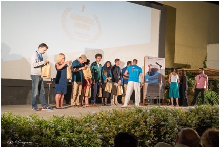 All the attending delegates on stage receiving a gift of local ingredients from Crete, courtersy of the festival and its sponsors. Photo Credit: Pantelis Sakkadakis
